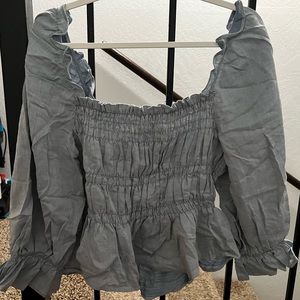 Blue stretchy off the shoulder top, or can be put on the shoulders